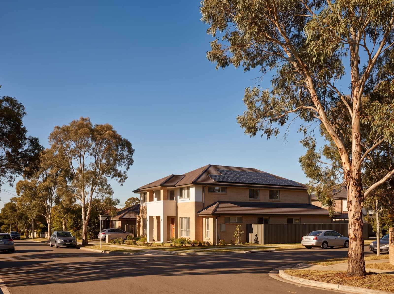 Brick family home with rooftop solar in a western Sydney suburb on a hot summer afternoon